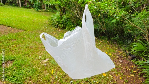 Photos White plastic shopping bag caught in tree for international plastic bag free day concept