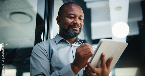 Foto Business, black man and writing with tablet in office for research, court case and legal evidence