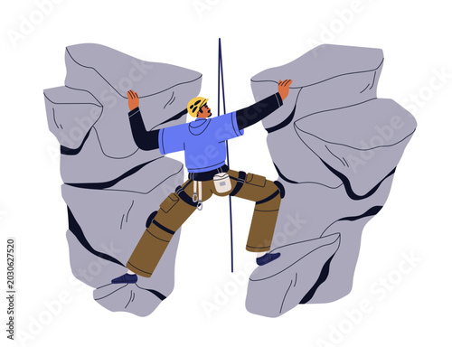 Male climber spreading between two rock cliffs, holding with arms. Crevice, c...