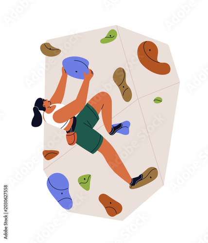 Woman climbing, bouldering on indoor wall with stone holds. Female climber at...