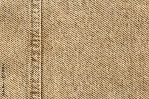 beige jeans denim fabric texture background with seam