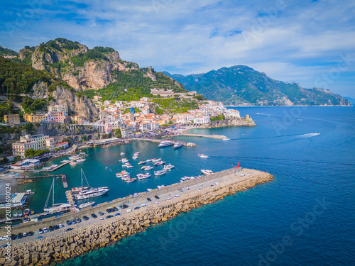 Aerial drone panorama of Amalfi town on the Amalfi Coast, scenic Mediterranean coastline and historic Italian seaside architecture
