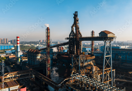 Photos Aerial view of Wuhan steel plant, featuring a complex geometry of massive blast furnaces and intricate pipelines