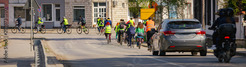 Group of cyclists on city road, street, asphalt