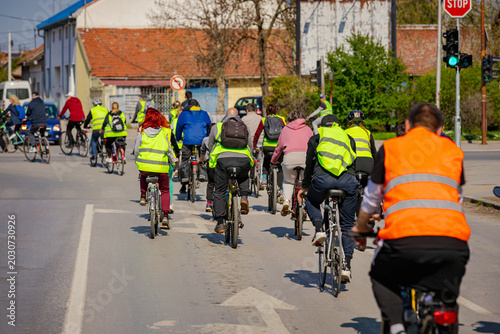 Group of cyclists on city road, street, asphalt