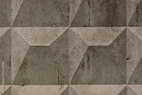 Gray background with geometric concrete wall texture. Modern architectural surface with grunge details, ideal for backgrounds, wallpapers, construction themes, branding.