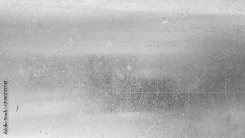 Brushed silver stainless steel metal surface texture with highlights