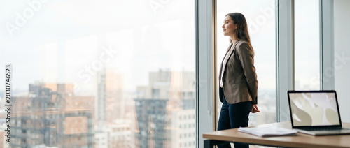 Professional taking a window break to reset focus
