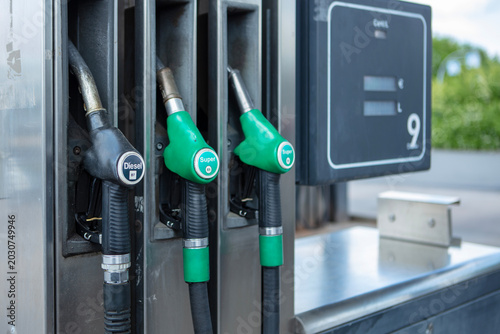 Multiple fuel nozzles at self service petrol station 
