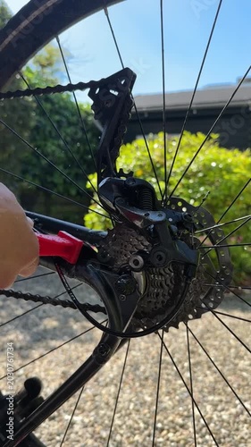 Washing bicycle drivetrain and rear wheel with water and cleaning tools