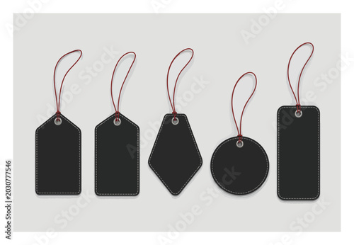 Collection of five black price tags with red string hangers