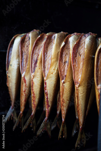 Fresh fish being smoked in the outdoor smoke house in Dziwnow in Poland