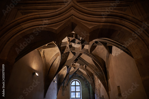 Bild auf Leinwand Gothic ribbed vault ceiling in historic cathedral interior