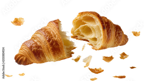 Foto Golden brown croissant broken in half showing flaky layers