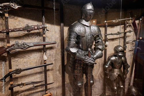 Tableau sur toile Knight armor and antique weapons in museum display