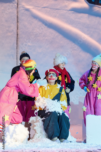 A group of cheerful clown actors on the theater stage