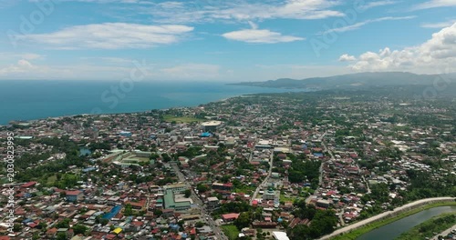 Iligan City with residential area in riverside. Northern Mindanao, Philippines. Cityscape.