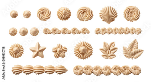 Piped buttercream frosting swirls and borders set, decorative beige cream icing shapes on white, collection of 20 pastry bag piping elements for cake design