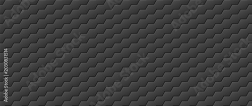 Diagonal repeating hexagonal tile pattern with embossed ridges on dark gray surface.