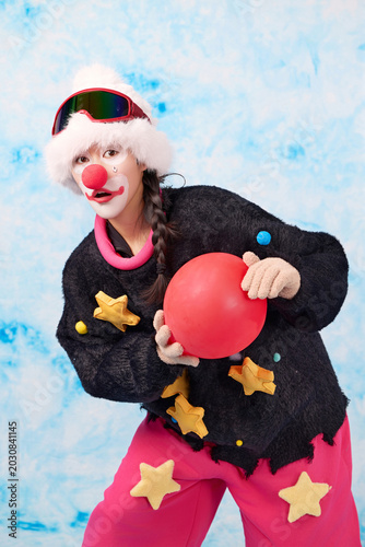 Asian women dressed as quirky and cute red-nosed clowns