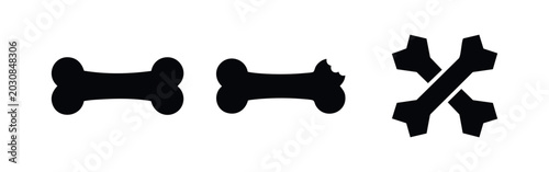 Obraz na płótnie Set of black dog bone silhouettes including a standard bone, a chewed bone with a bite mark, and crossed bones