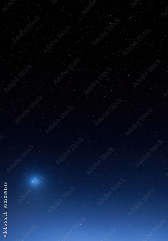 Obraz premium Stunning Night Sky with Bright Blue Glowing Celestial Object and Countless Stars Background