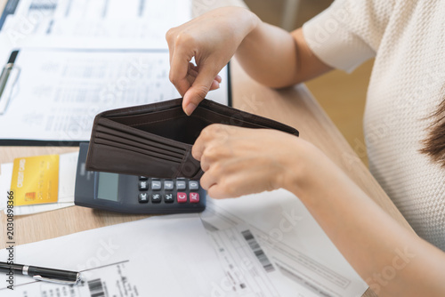 Bild auf Leinwand Debt financial concept, stressed problem asian woman hand open empty wallet, purse not have budget of money to pay no have credit card, not able payment bill, loan or expense with bank, bankruptcy