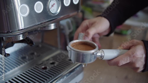Tamping Coffee Grounds in Portafilter for Espresso