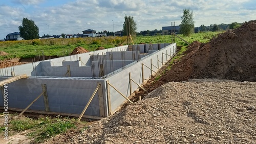 Konstfotografi Construction site with ICF insulated concrete forms foundation walls for a modern residential house building project