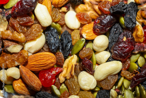 Canvas Print A nutritious mix of various nuts, dried fruits, and seeds is presented in a close-up view as a vibrant healthy snack
