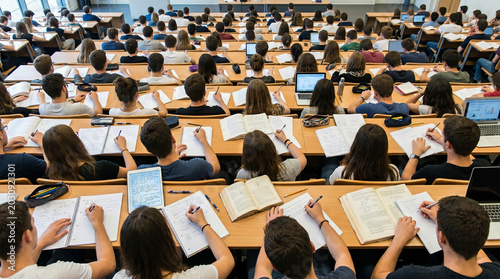Obraz na płótnie Students taking notes in university lecture hall