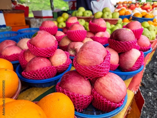Apples and lemons for sale at the fruit stall in malaysia.