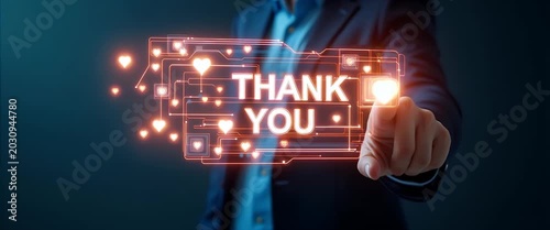 Hand interacting with holographic thank you message interface showing glowing Thank You symbols in empty space concept as Hand interacts with holographic thank you message interface displaying glowing