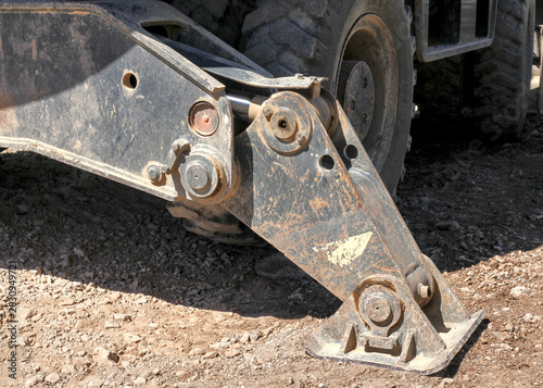 Konstfotografi Close-up of a hydraulic outrigger stabilizer leg on heavy construction machinery