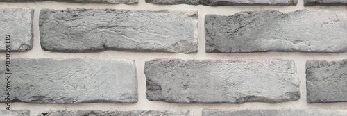 Slika na platnu Gray brick wall with a textured surface