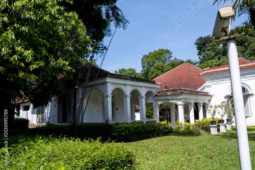 Konstfotografi The historic Melchior Building, built in 1884, stands within Bogor Botanical Gardens surrounded by lush tropical greenery