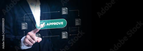 Digital Approval Process: A person in a suit presses a large green button labeled APPROVE, surrounded by digital icons representing documents and a workflow, symbolizing a modern.