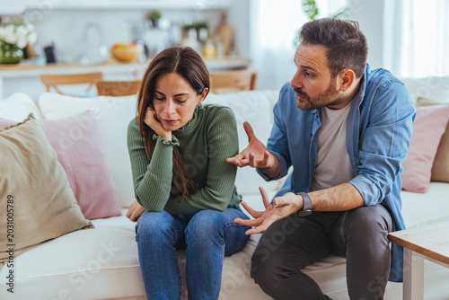 Couple Arguing on Sofa in Living Room Showing Relationship Conflict and Emotional Tension