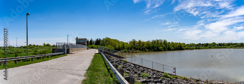 Canvas Print View of Claireville Dam and Reservoir under blue sky.