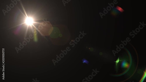 optical light ray loop animation on black screen. Sun rays view, sun spotlight glowing burst concept. optical light beams on black background. 