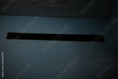 Fotografía Black rectangular object on gray surface indoors