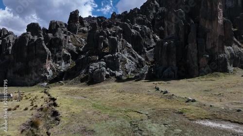 Low-altitude drone fly-through among rock formations at Huayllay Stone Forest in Pasco, Peru