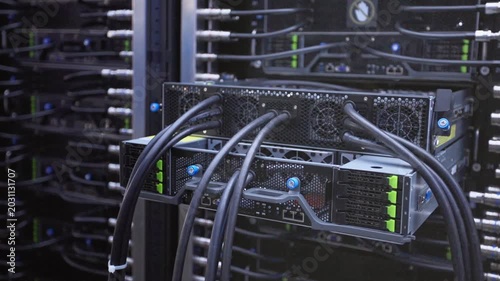 Slow motion close-up of computer hardware and server components displayed, technology