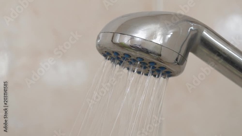 Water flows out of shower head with sound. Shower head in bathroom, close-up shot video with sound
