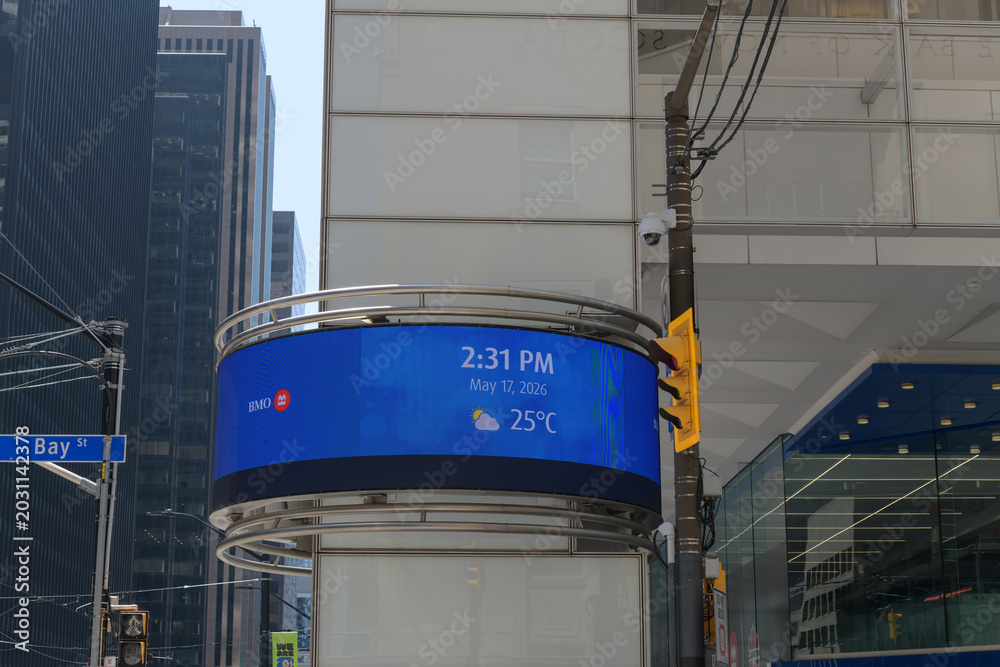 Fototapeta premium date, time, and weather electronic sign outside BMO, Bank of Montreal Financial Group headquarters at First Canadian Place, King and Bay, Toronto