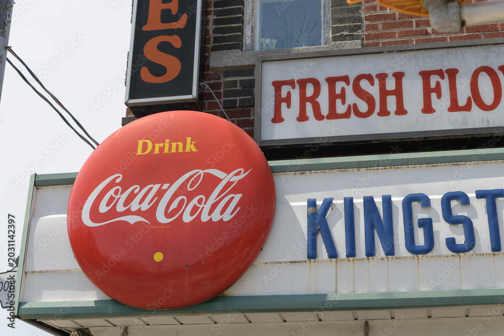 Naklejka premium vintage round Drink Coca-Cola button sign outside Kingston Road Flower Market, 966 Kingston Rd, Toronto