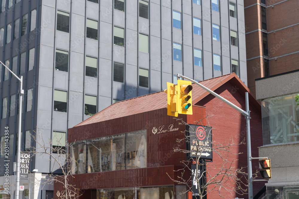 Naklejka premium wide view of Loro Piana, a clothing store, located here at 111 Bloor St W, Toronto