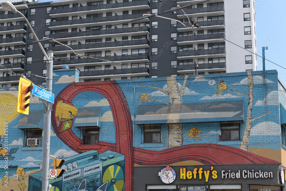 Naklejka premium mural and sign on the side of Heffy's Fried Chicken, a restaurant, located at 1054 Kingston Rd (at Victoria Park Av), Scarborough, Toronto