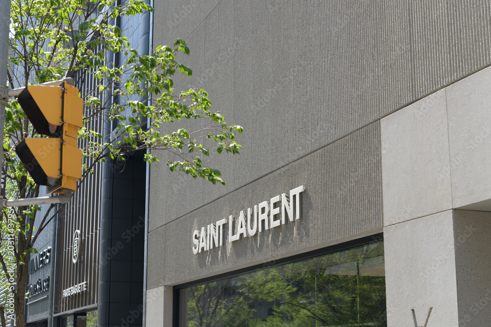 Naklejka premium exterior building and sign of Saint Laurent, a luxury clothing store, located here at 110 Bloor St W, Toronto