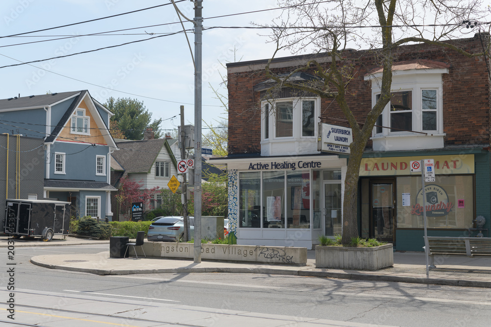 Naklejka premium exterior building and sign of Active Healing Centre, a massage therapist, located at 937 Kingston Rd, Toronto (and old Laundromat)